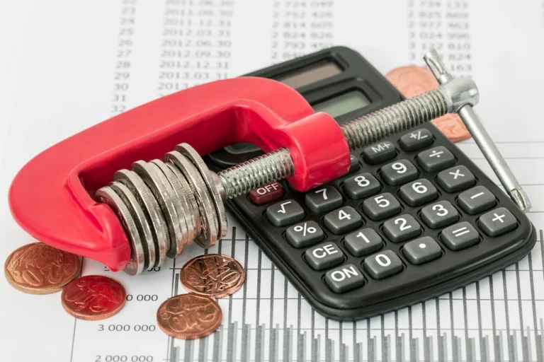 Budgeting and financial planning with a calculator and notebook